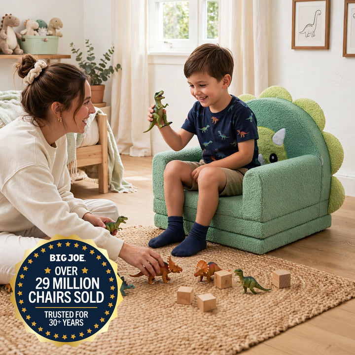 A child sits in a green dinosaur-style children&