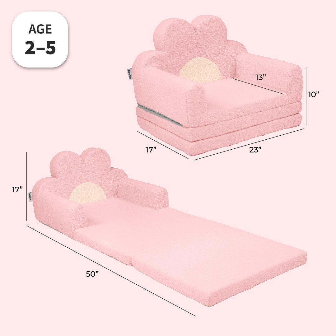 Pink cloud-shaped toddler floor sofa with a built-in headrest and armrests, shown in two views with dimensions: one as a small seat cushion and one as a floor bed. Includes an &