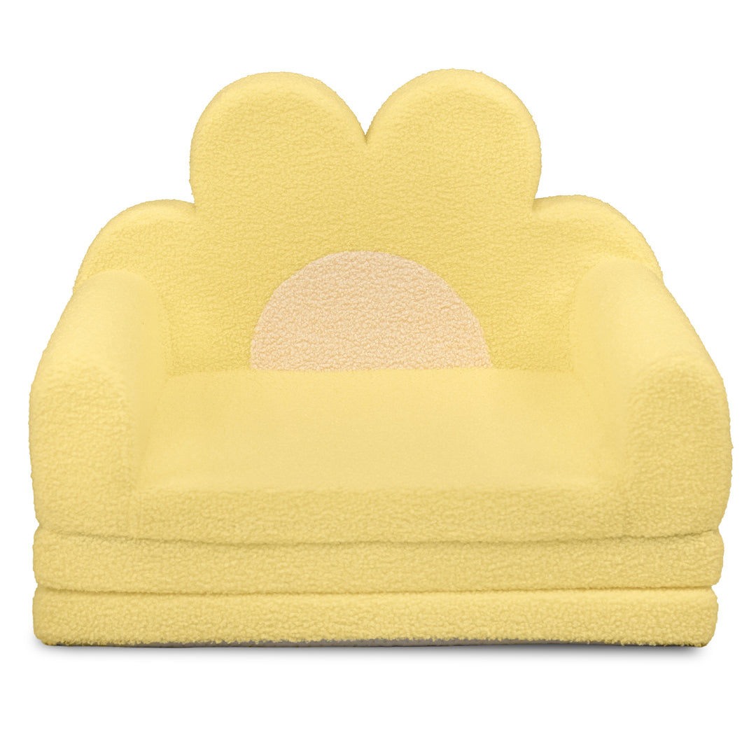 A small yellow sheepskin-style armchair with a flower-shaped backrest and a crescent moon cutout in the center, shown on a plain white background. 