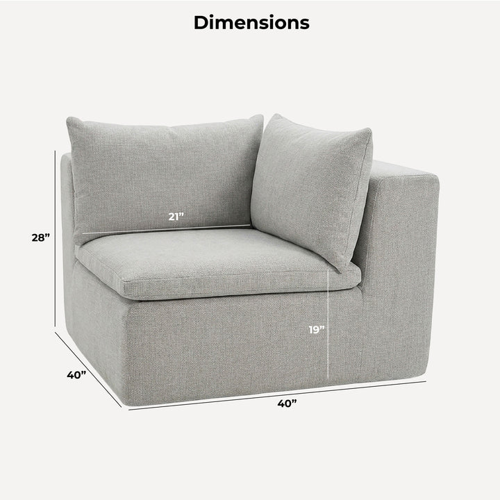 Gray corner sofa with dimensions marked in a room with large windows and plants. 