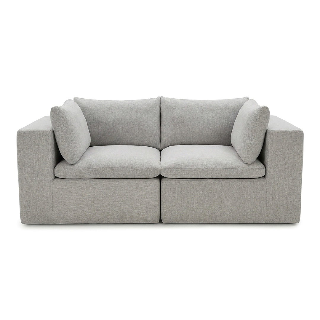 Gray sofa with curved armrests on a white background 