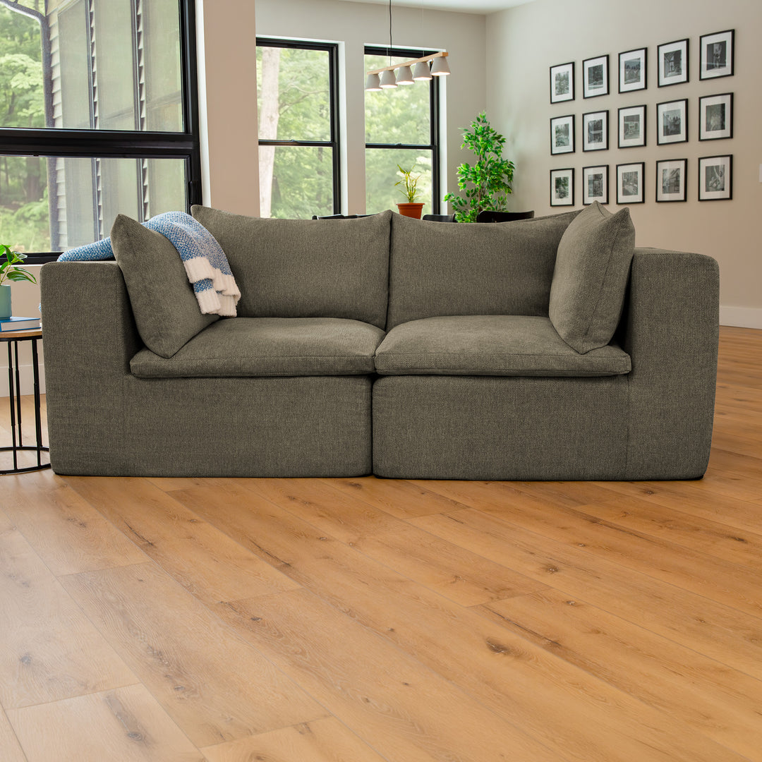 Averra Sectional Loveseat in the living room with wood flooring 