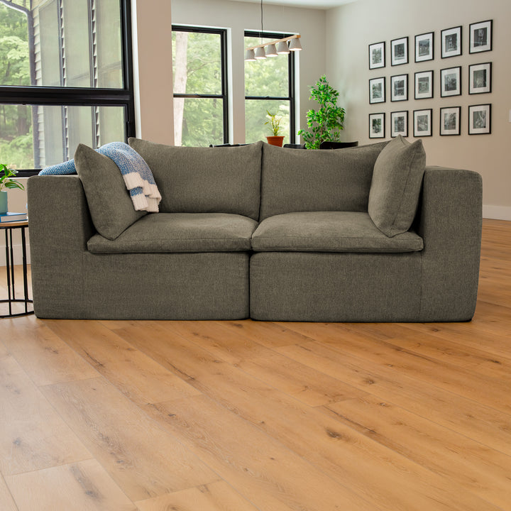 Averra Sectional Loveseat in the living room with wood flooring 