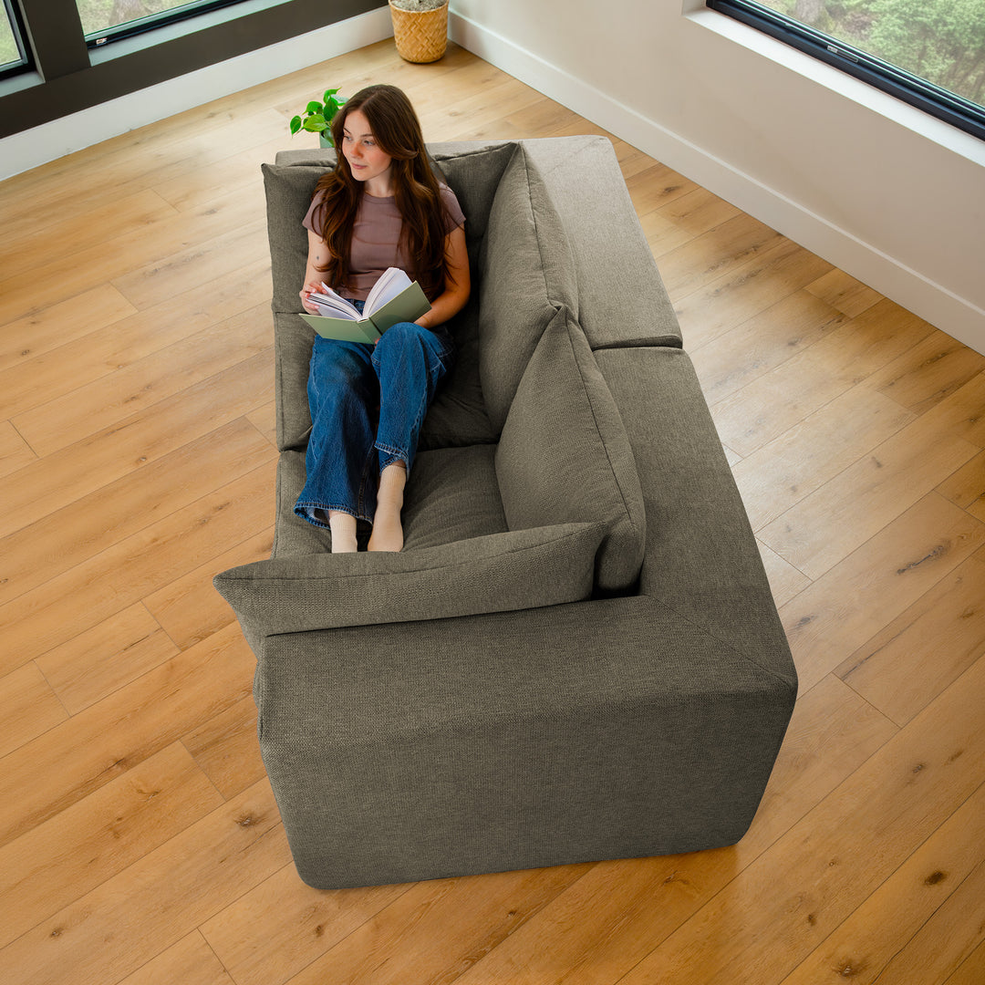 Reading on an Averra 2pc Loveseat 