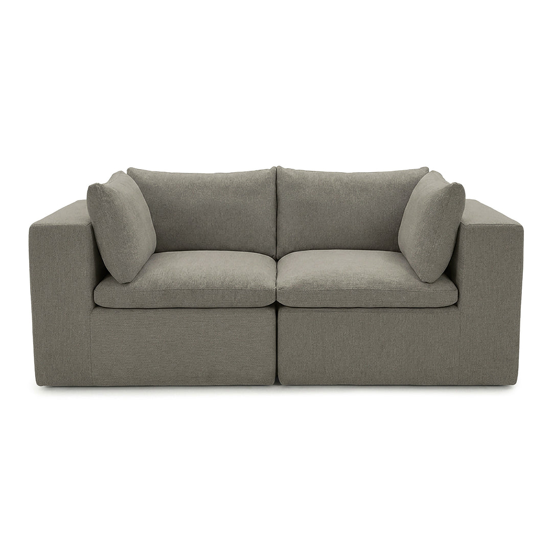 Gray loveseat sofa with curved backrest and armrests on a white background 