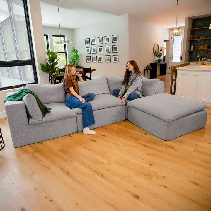 Friends chatting on a pillowtop sectional couch 