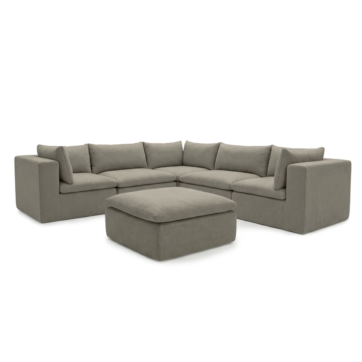 A modern L-shaped sectional sofa in a textured gray fabric, featuring a matching square ottoman, shown against a plain white background. 