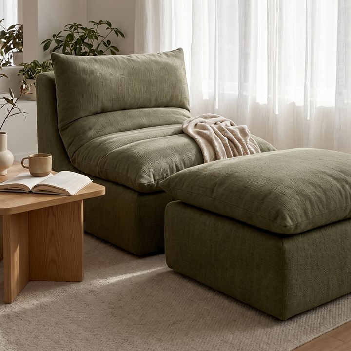 Green sectional sofa in a living room with a wooden coffee table and plants. 