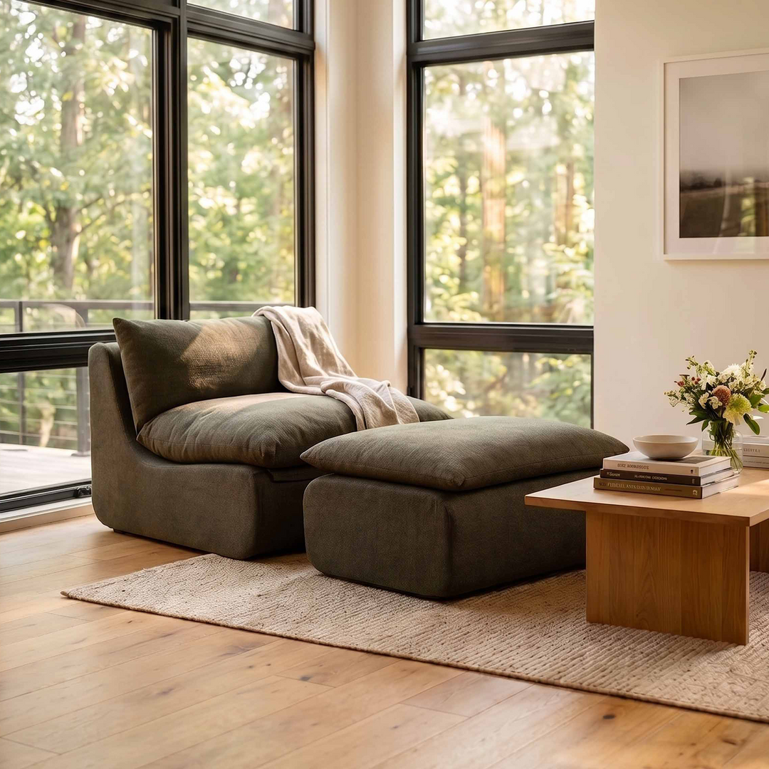 Modern living room with a sectional sofa, coffee table, and large windows. 