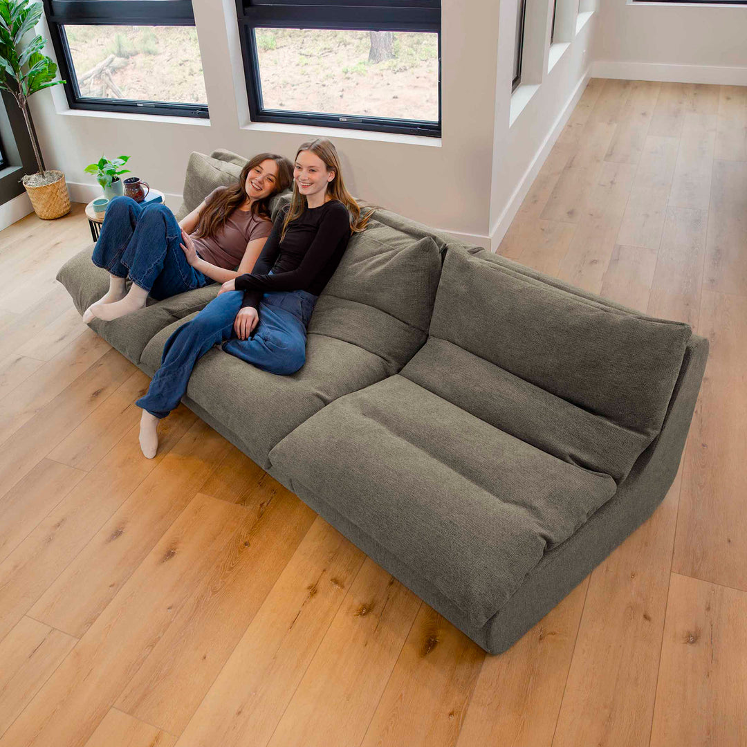 Women sitting on a sectional sofa in the living room 