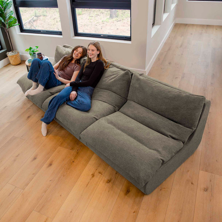 Women sitting on a sectional sofa in the living room 