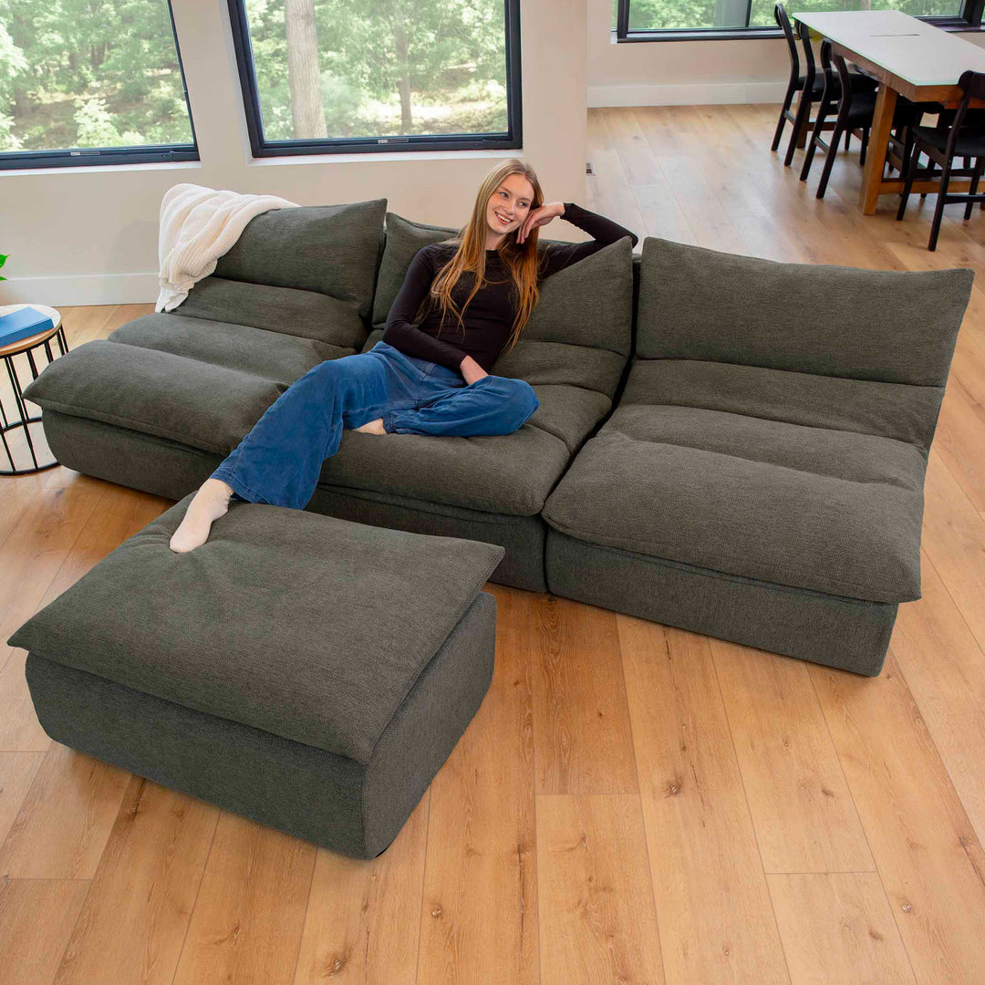 Woman lounging on a pillow-top couch 