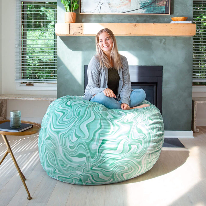 Woman on foam filled beanbag chair #color_groovy-green-plush