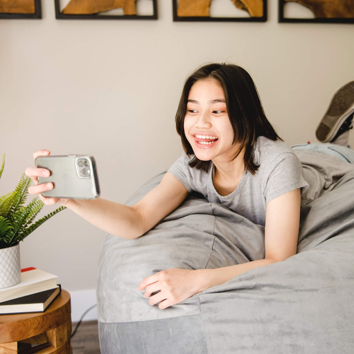Fuf large grey plush foam beanbag chair woman taking pictures 