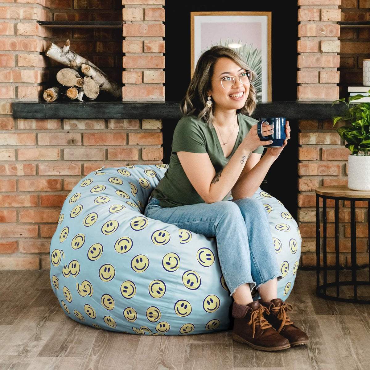 Girl drinking coffee on Fuf medium foam beanbag chair 