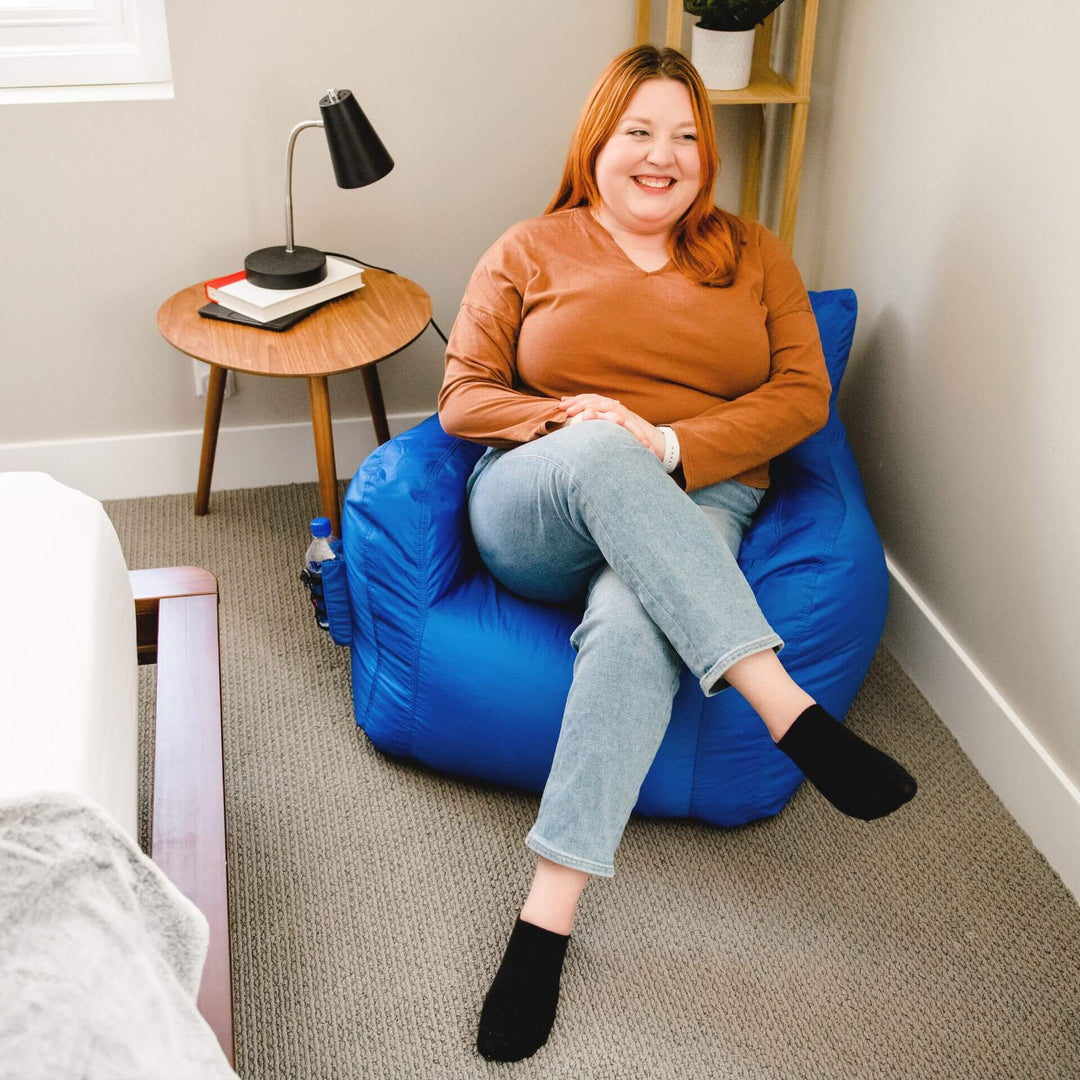 Dorm room chair woman relaxing #color_sapphire-smartmax