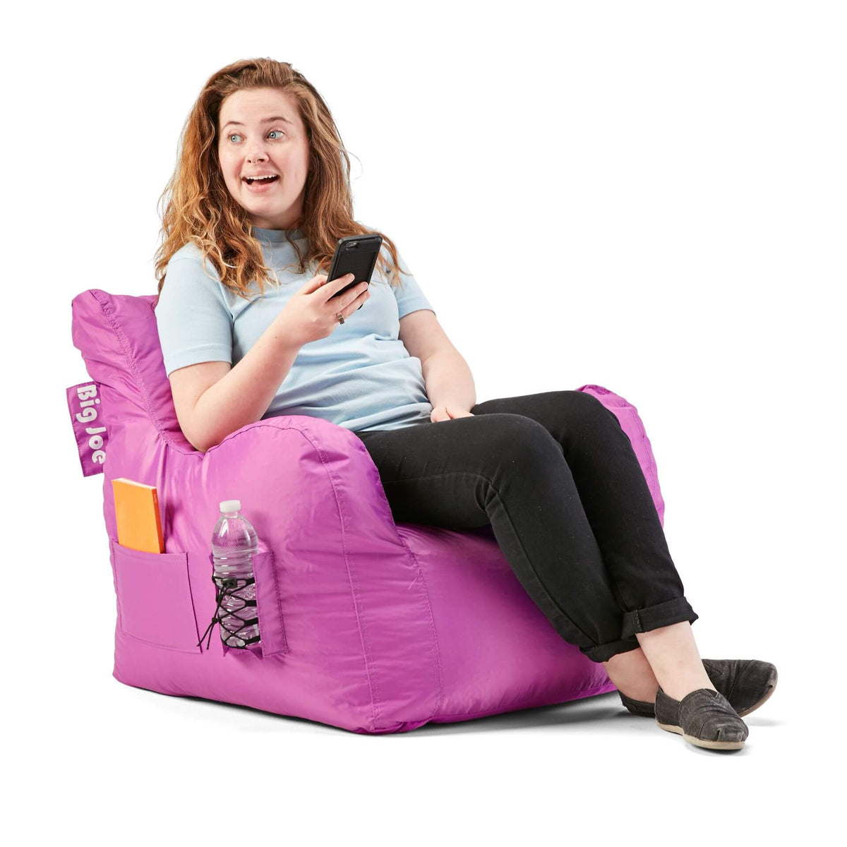 College student on purple beanbag dorm chair 