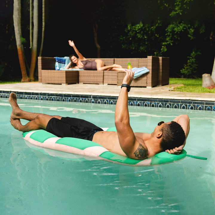 Pool Float with man relaxing #color_green-palm