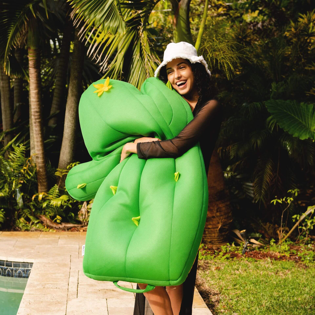 Girl hugging cactus pool float #color_cuddly-cactus