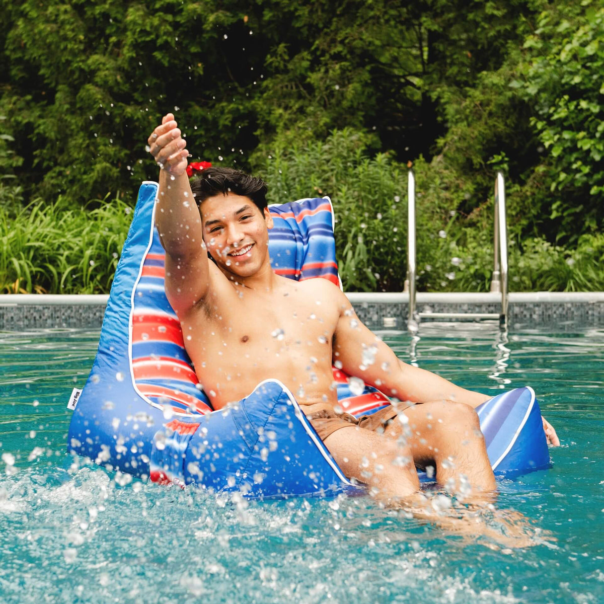 Big Joe Captains Float Blurred Americana teen floating in pool 