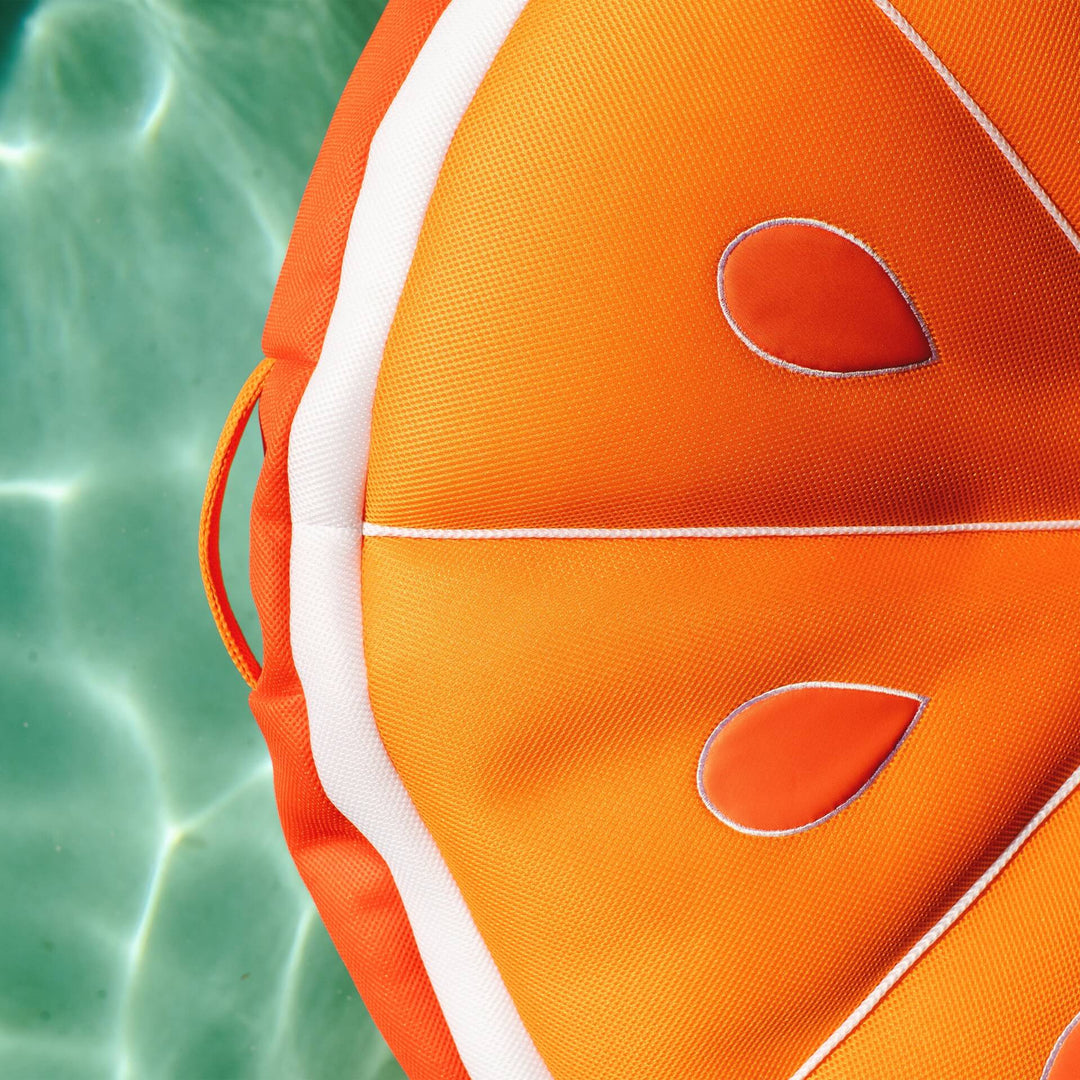 Bean Filled Pool Float shaped like orange fabric close up #style_orange